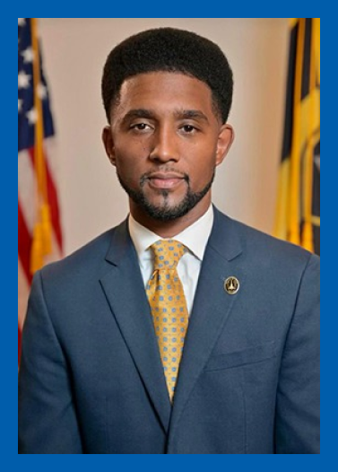 Headshot of Baltimore Mayor Brandon Scott with a blue border.